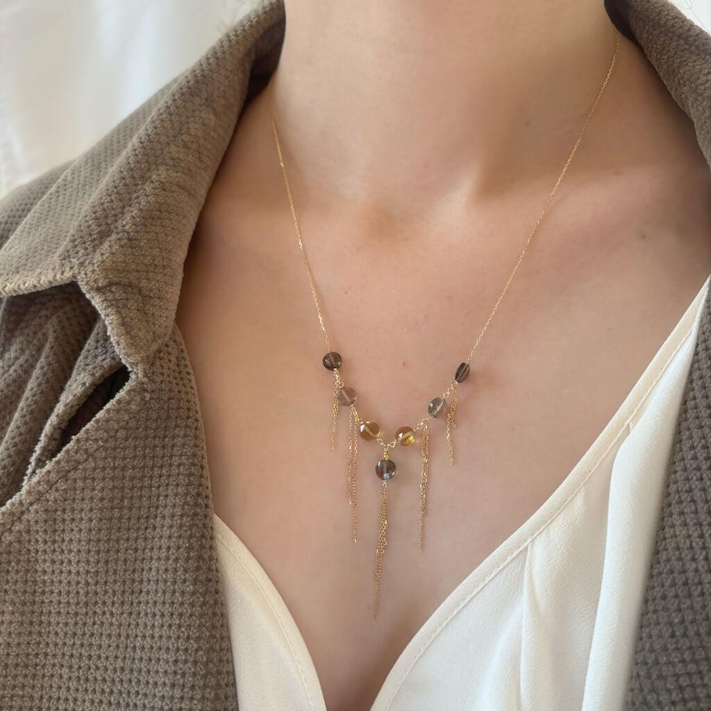 Citrine and smoky quartz gemstone 18k gold necklace with tassel on model