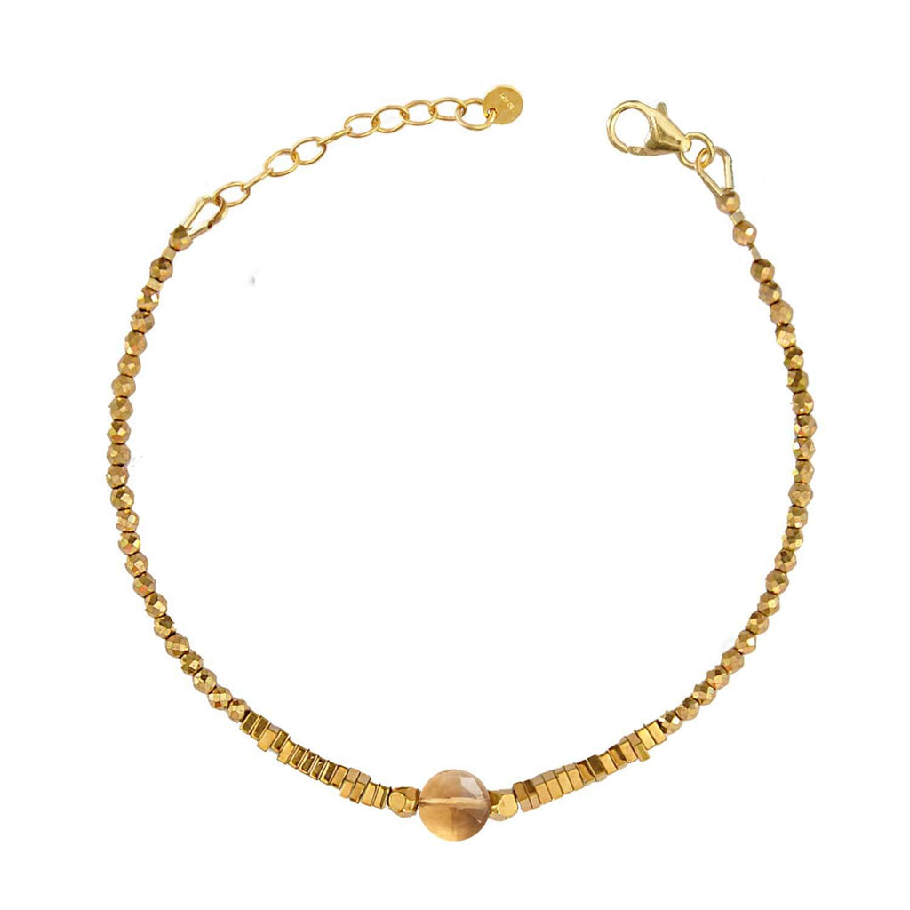 Elegant Hematite Beaded bracelet with a central faceted citrine gemstone on a white background. Perle de Lune jewelry