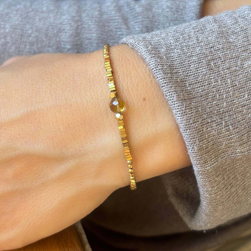 Close-up of a beaded bracelet with Citrine and golden Hematite gemstones