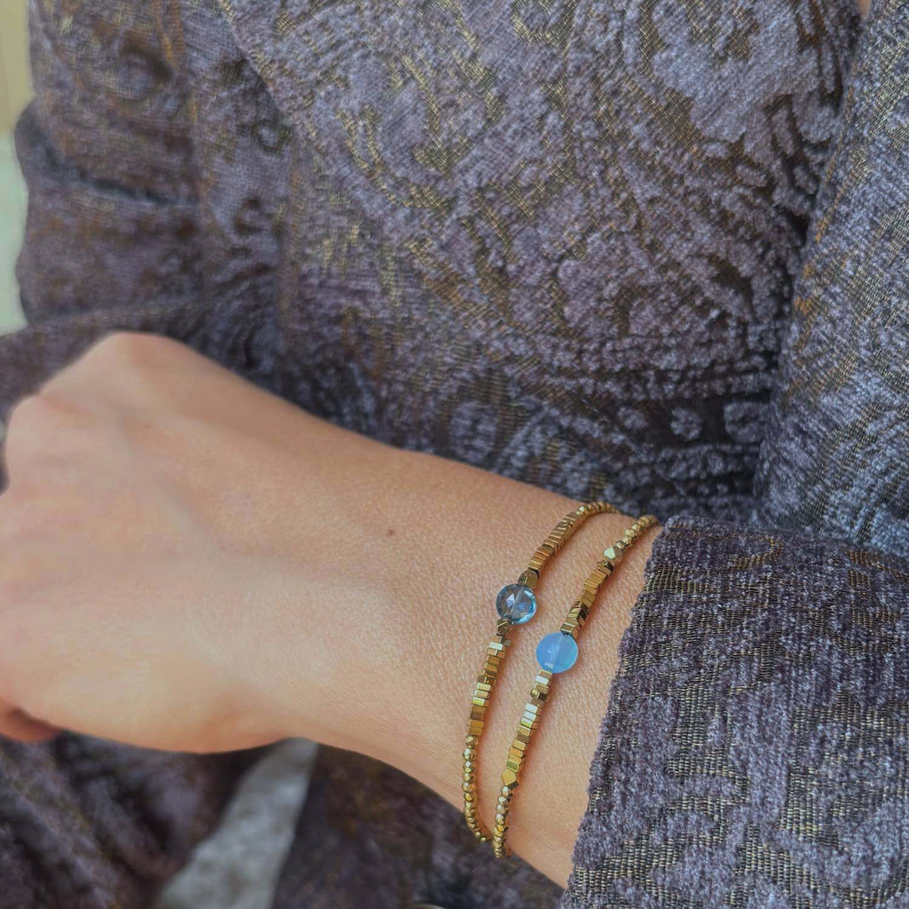 2  blue Topaz and Blue Quartz and  golden Hematite gemstone  Bracelets on a model wrist