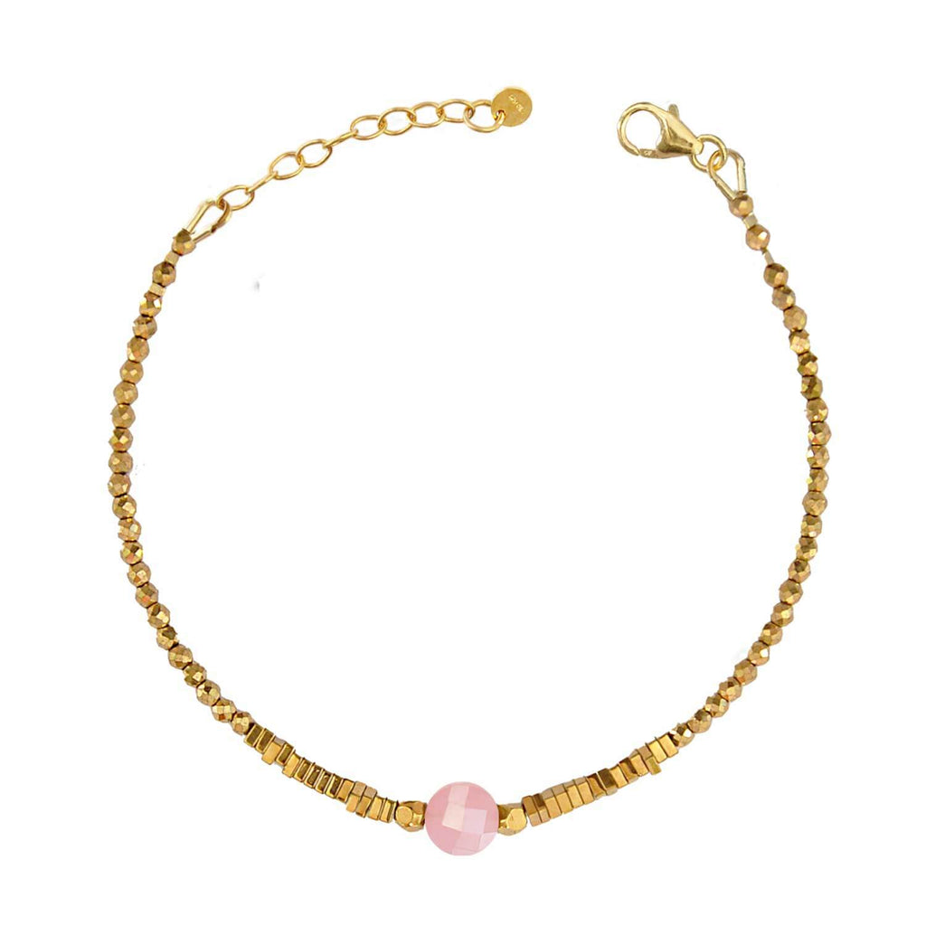 Elegant Hematite Beaded bracelet with a central faceted pink quava quartz gemstone on a white background. Perle de Lune jewelry