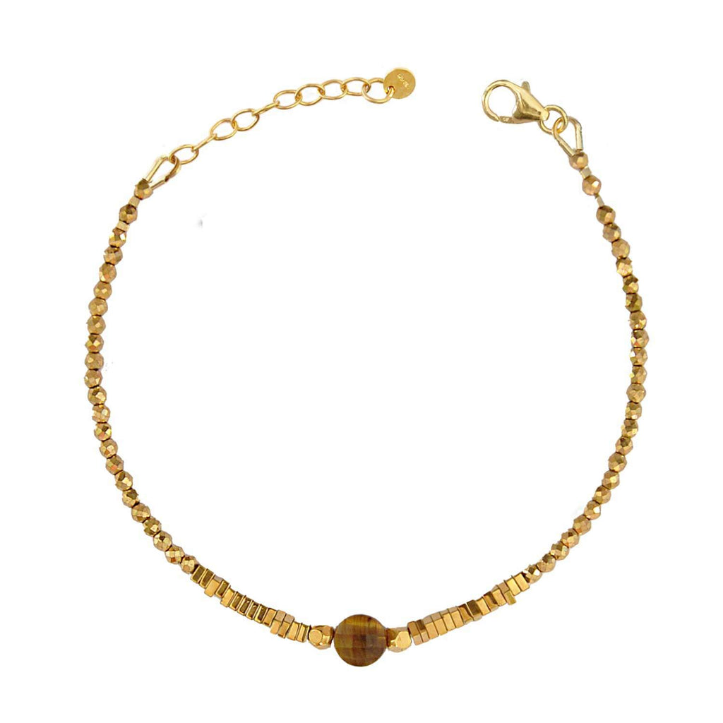 Elegant Hematite Beaded bracelet with a central faceted tiger's eye gemstone on a white background. Perle de Lune jewelry