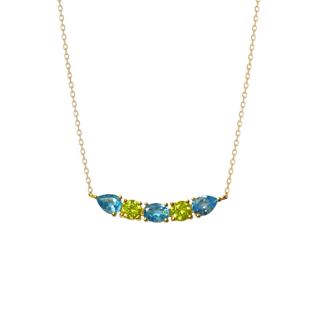 A luminous and unique 18k gold choker necklace with a central curved bar pattern of Swiss Blue Topaz and Peridot set on claws. Spectacular and easy to wear.