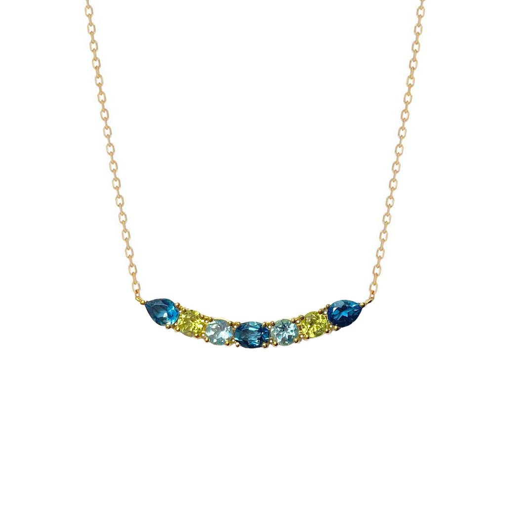 A luminous and unique 18k gold choker necklace with a central curved bar pattern of London and Swiss Blue Topaz and Peridot set on claws. Spectacular and easy to wear.