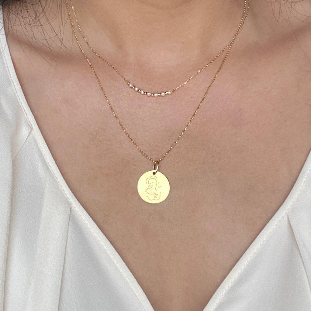 Muze 18k gold Vermeil Child Medal necklace, on model, art inspired jewelry symbol of love, protection, tenderness and motherhood. A meaningful sentimental gift perfect for mother, newly born or godchild