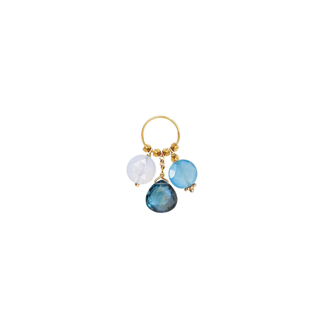 A trio of gemstone charms hanging from a ring in 18k gold with Blue Chalcedony, Blue Topaz, Blue Quartz 